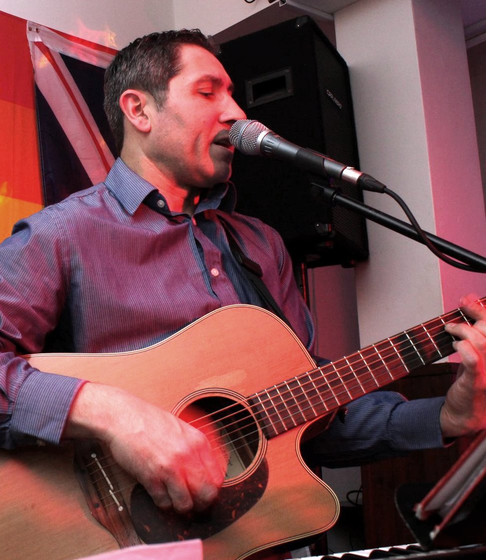 singing with guitar at the Oak Vaults pub Antoine singing with guitar at the Oak Vaults pub